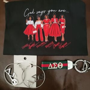 SPECIAL SALE.  DST makeup bag with earrings and keychain.